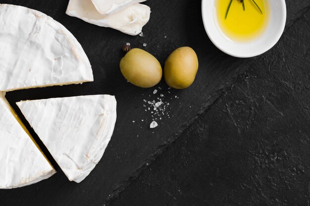 flat lay cheese composition on black background