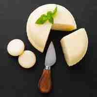 Free photo flat lay cheese with knife