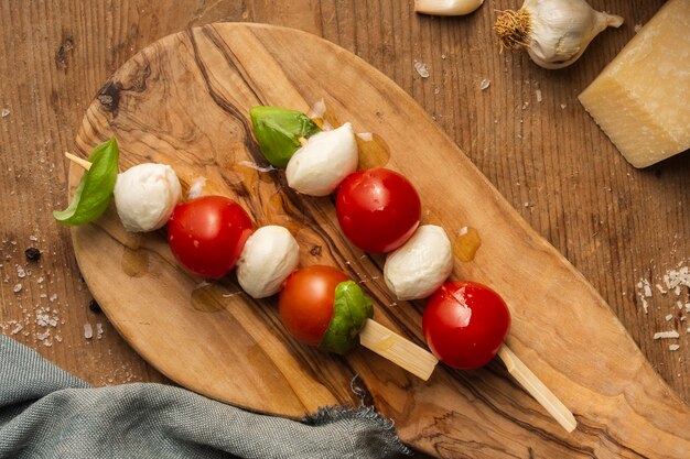 Flat lay cherry tomatoes and mozzarella skewers