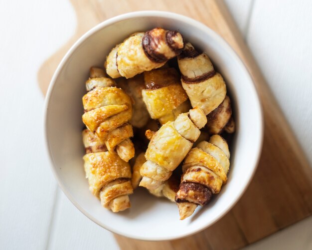 Flat lay of chocolate croissants in bowl