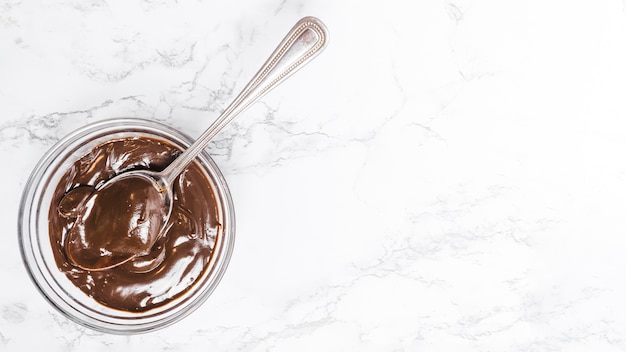 Flat lay chocolate pudding in a bowl