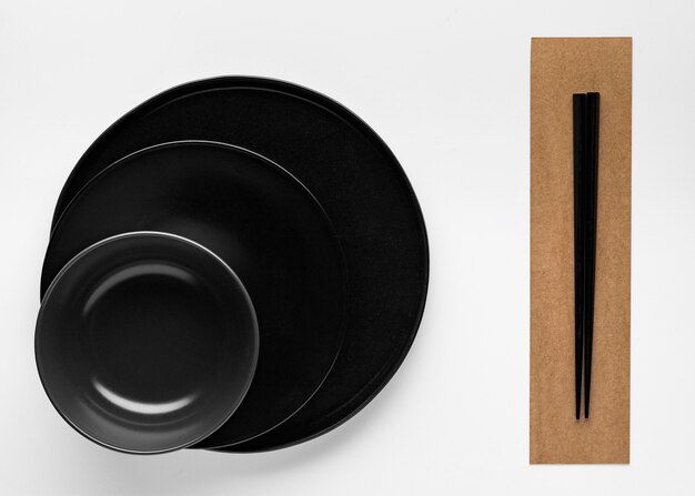 Flat lay of chopsticks with dinnerware