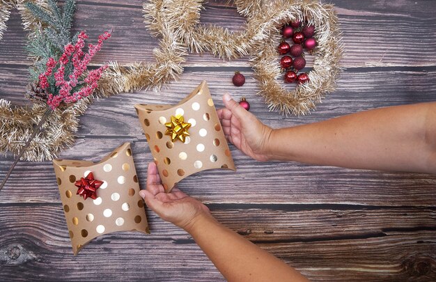 Flat lay of Christmas boxes on wooden board