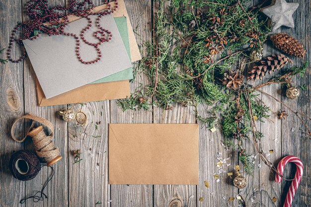 Flat lay christmas composition with letters on a wooden surface