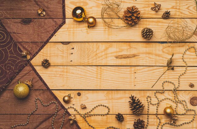 Flat lay of Christmas decorations on a wooden texture