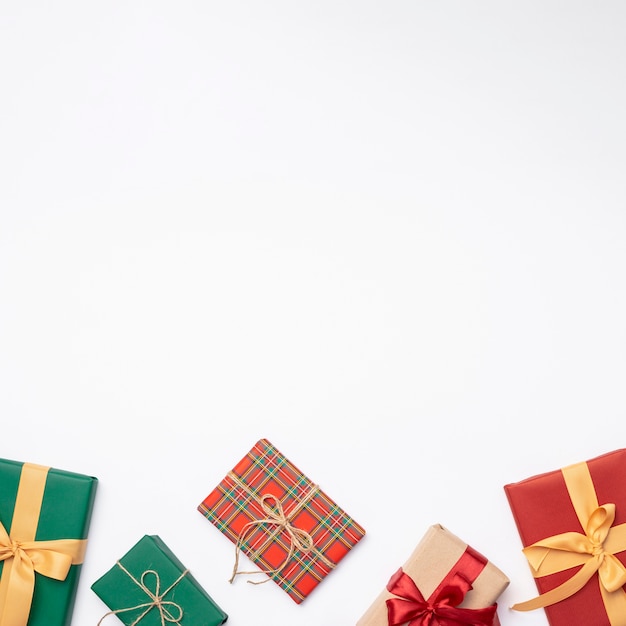 Flat lay of christmas gifts on white background with copy space