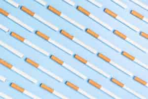 Free photo flat lay cigarettes on blue background