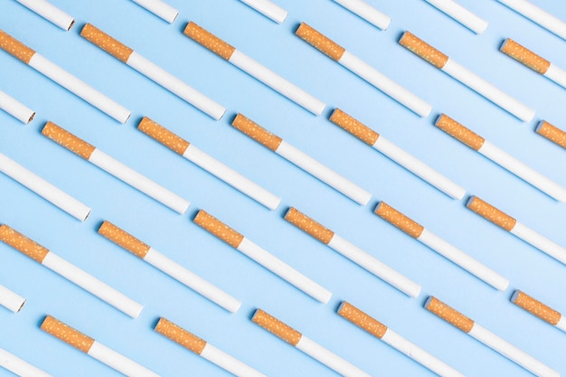 Flat lay cigarettes on blue background