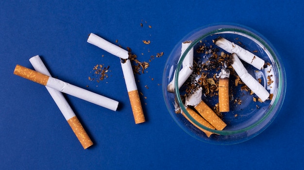 Flat lay cigarettes with ashtray