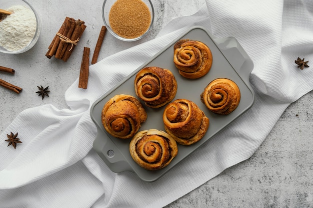 Free photo flat lay cinnamon rolls arrangement