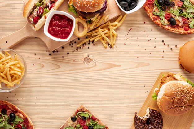 Flat lay circular frame with delicious fast food