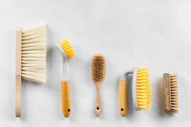 Free photo flat lay of cleaning brushes