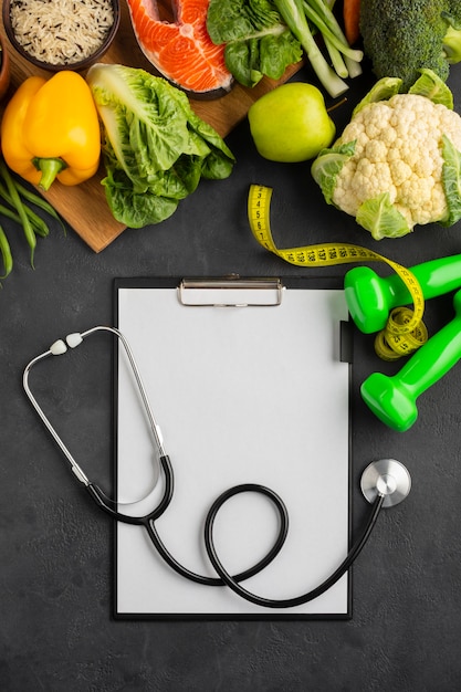 Flat lay of clipboard and vegetables