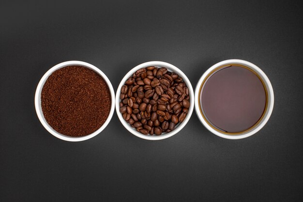 Flat lay coffee arrangement on black background