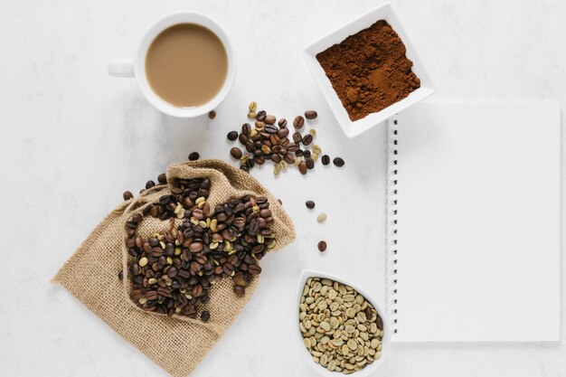 Flat lay of coffee with notebook mock-up