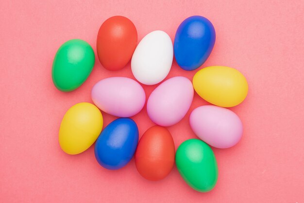 Flat lay colored eggs on table