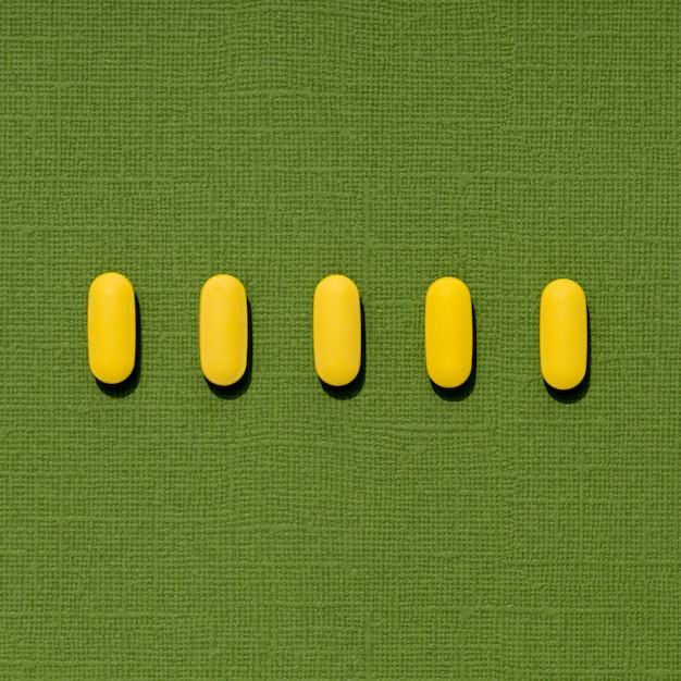 Free photo flat lay of colored pills