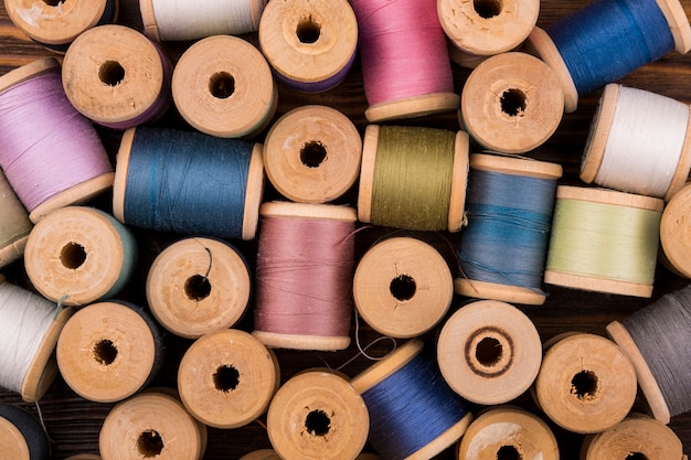 Flat lay of colored thread spools