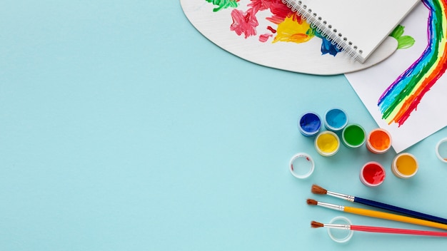 Flat lay of colorful aquarelle with copy space