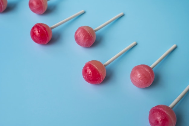 Free photo flat lay colorful ball lollipops