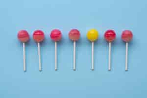 Free photo flat lay colorful ball lollipops