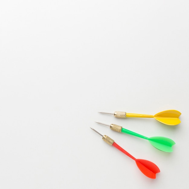 Flat lay of colorful darts with copy space