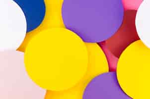 Free photo flat lay of colorful filled paper circles