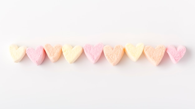 Flat lay of colorful heart-shaped candy string