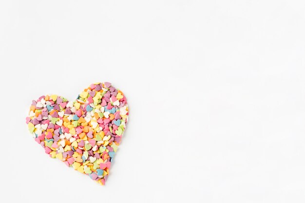 Flat lay of colorful heart-shaped sprinkles