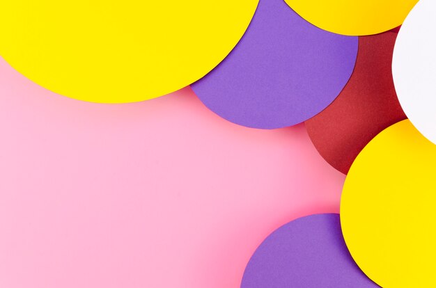 Flat lay of colorful paper circles with copy space