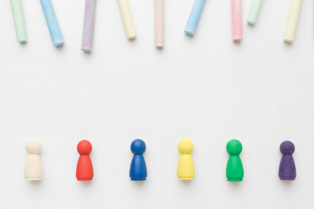 Free Photo flat lay colorful pawns on white background