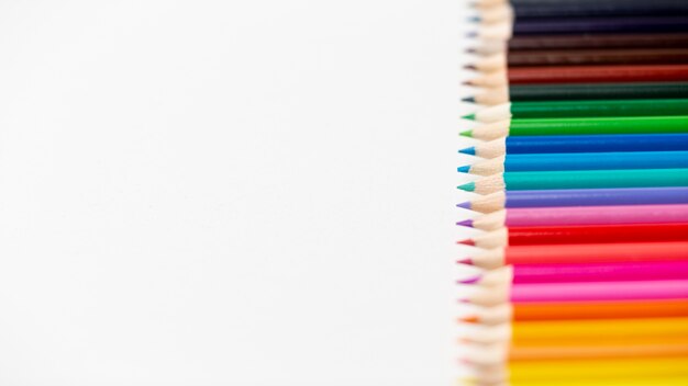 Flat lay of colorful pencils with copy space