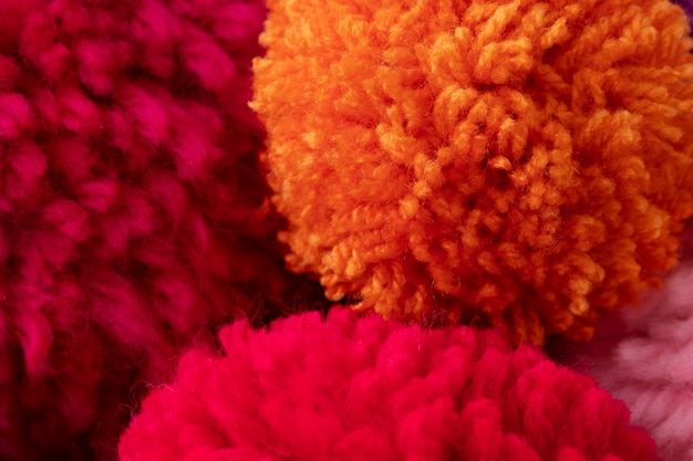 Flat lay colorful pom poms arrangement