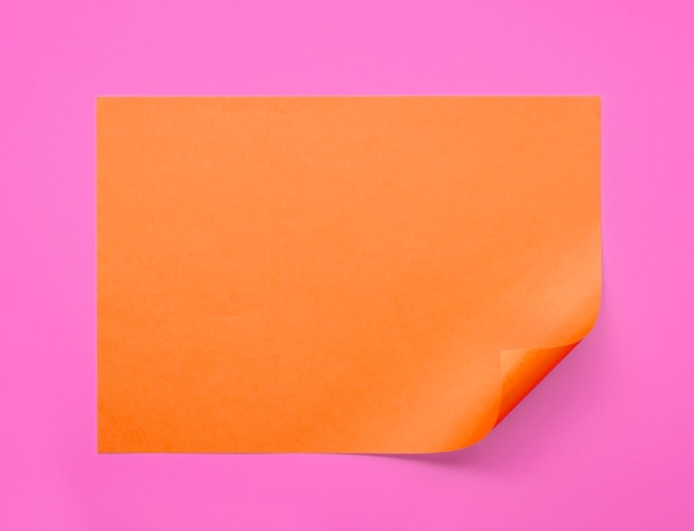 Flat lay of colorful sheet of paper with twisted corner