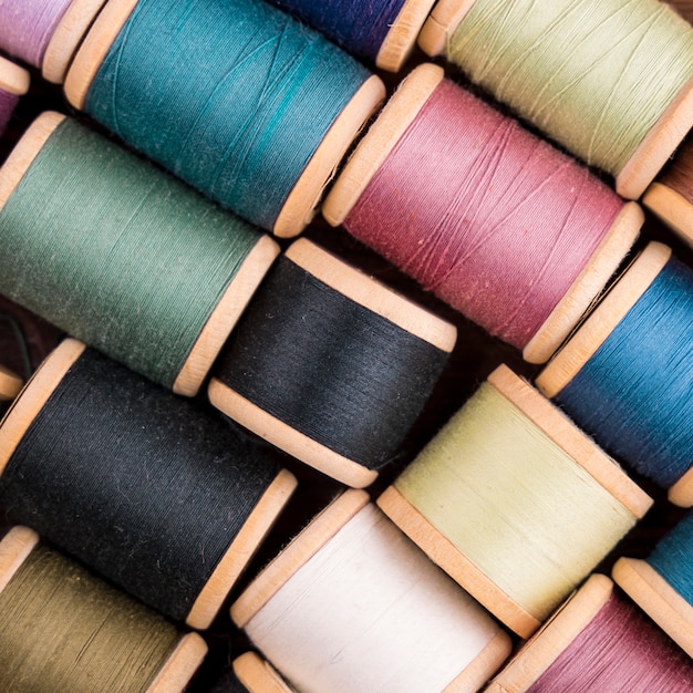 Flat lay of colorful thread spools