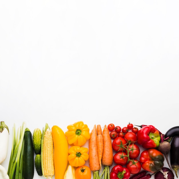 Flat lay colourful composition of vegetables with copy space
