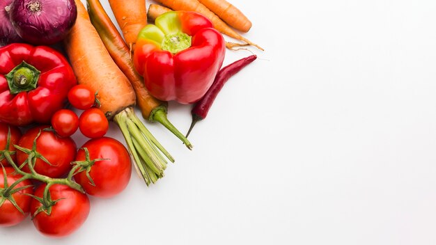 Flat lay colourful composition of vegetables with copy space