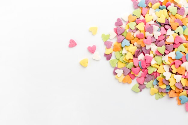 Flat lay of colourful heart-shaped sweets