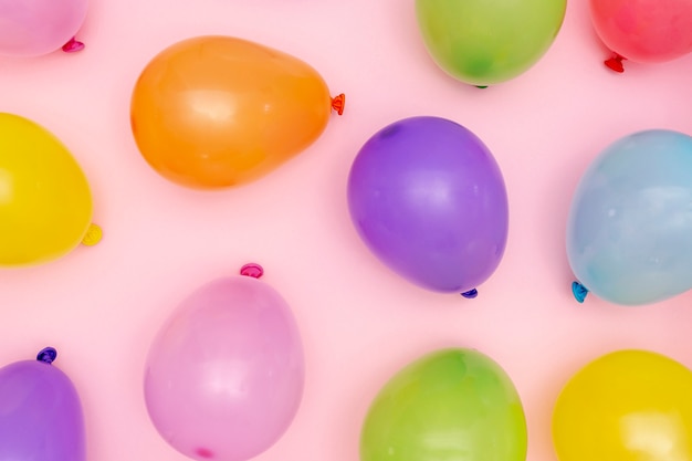 Flat lay colourful inflated balloons arrangement