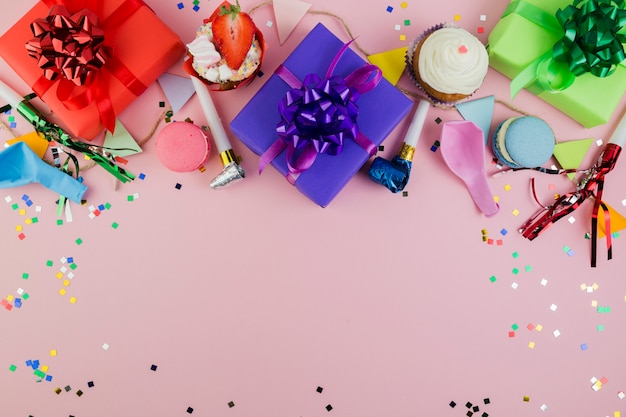 Flat lay composition of birthday elements with copyspace