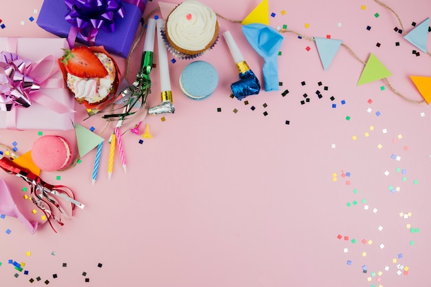 Flat lay composition of birthday elements with copyspace