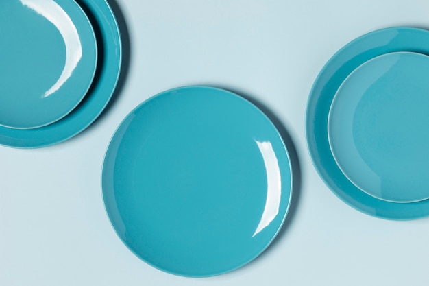 Flat lay composition of blue plates