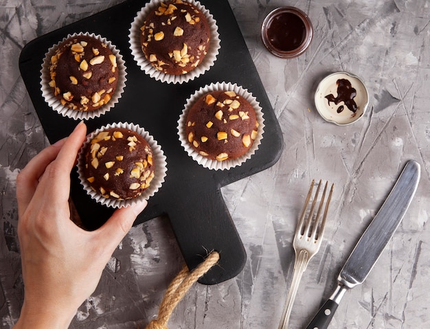 Free photo flat lay composition of chocolate cupcakes