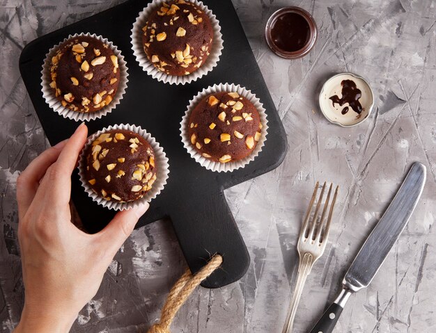 Flat lay composition of chocolate cupcakes