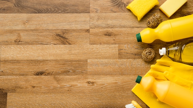 Flat lay composition of cleaning products with copyspace