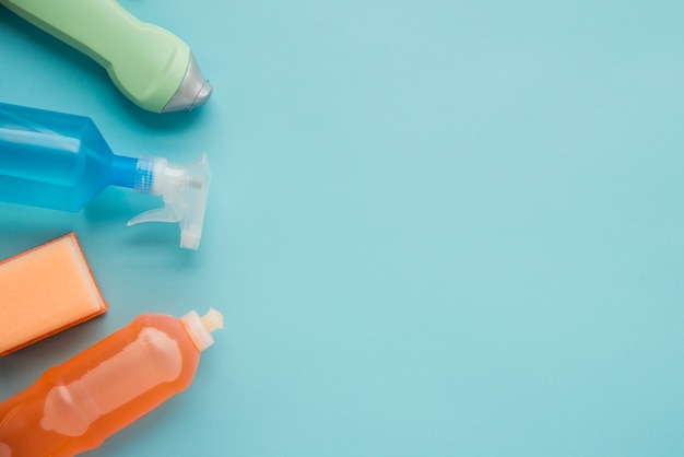 Flat lay composition of cleaning products with copyspace