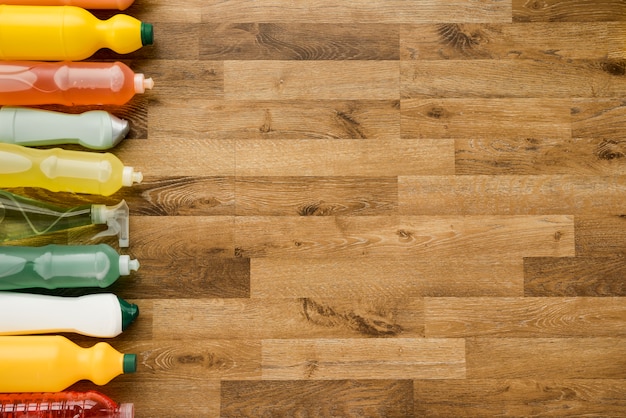 Flat lay composition of cleaning products with copyspace