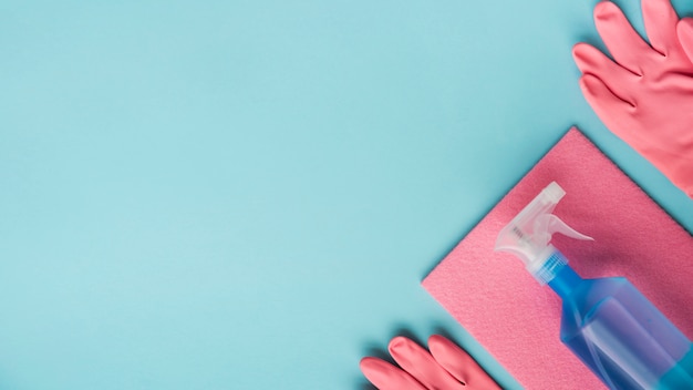 Flat lay composition of cleaning products with copyspace