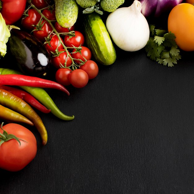 Flat lay composition of delicious fresh vegetables with copy space