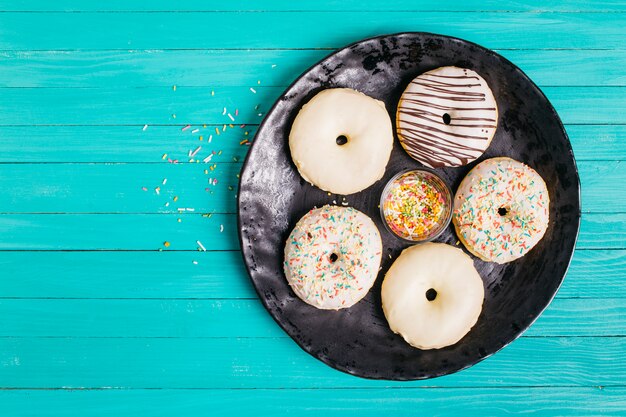 Flat lay composition of tasty donuts